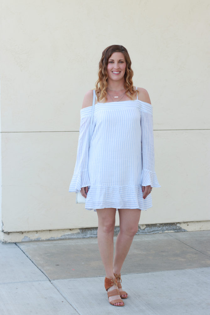 The perfect cold shoulder striped dress.