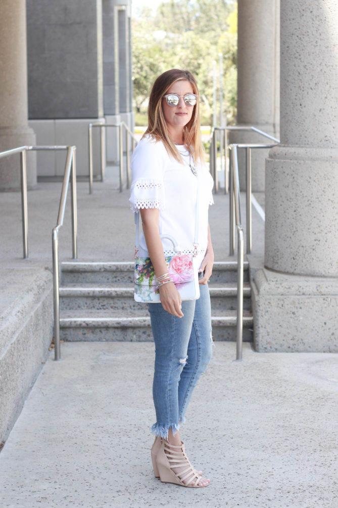 Fringe denim for spring with a floral printed purse and eyelet top.