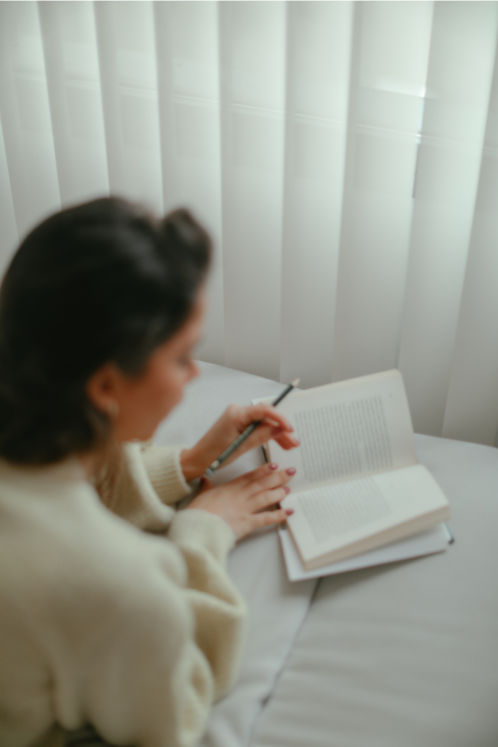 Megan Off The Mat, budget lifestyle blogger shares The Monthly Mindful Reset. Woman reading and journailing